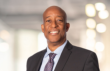 Professional headshot of Maxwell Sinclair